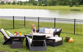 Cute,Little,Blond,Girl,Standing,Amongst,Comfortable,Modern,Design,Garden