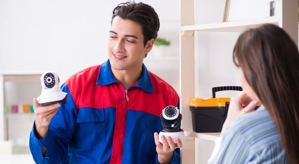 Client,Getting,Securty,Camera,Installed,At,Home,By,Contractor
