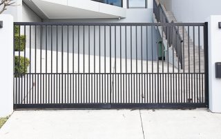 Automatic sliding gate with vertical metal bars (How to Choose the Best Gate for Your Home)